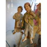 TWO CONTINENTAL BOY FIGURES