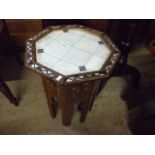 AN UNUSUAL ARABIAN OCTAGANAL COFFEE/WORK TABLE INLAID WITH MOTHER OF PEARL AND OTHER EXOTIC WOODS