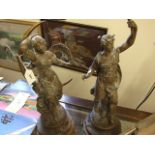 A PAIR OF FRENCH SPELTER FIGURES STAMPED BRUCHON 21" HIGH OF PHOEBE & APOLLON METAL PLINTHS
