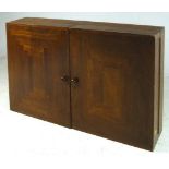 A 1960's teak wall mounted display cabin