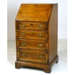 A reproduction George III style oak bure