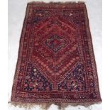 A Northern Persian tribal rug with a red