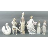 A group of Lladro and Nao porcelain figu