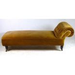 A Victorian chaise longue, with turned l