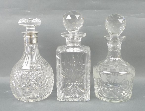 A group of cut glass decanters, comprisi