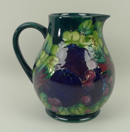 A Moorcroft pottery jug decorated in the - Image 2 of 3