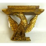 A gilt wood wall sconce in the form of a