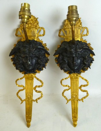 A pair of French gilded sconces, bronze