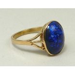 A 22ct gold and cabochon black opal ring