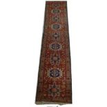 A Karajah runner, red ground, 327 by 70c