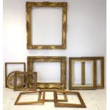 A group of eighteen picture frames, most
