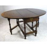 A Georgian oak gateleg table, the oval d