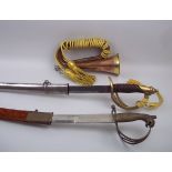 A modern cavalry sword and bugle, togeth