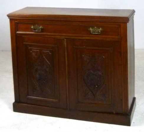 A mahogany cupboard with a single drawer