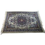 A Hamadan rug with central medallion on