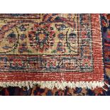 A large Isfahan carpet with red ground,