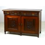 A walnut sideboard with bulge front draw