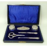 A silver and cut glass manicure set with