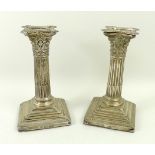 A pair of silver candlesticks, London 18