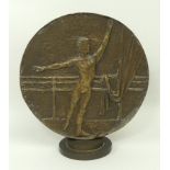 A 20th century bronze roundel depicting