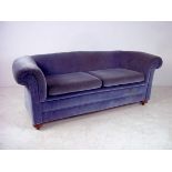 An Edwardian three seater settee with ro