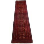 A Baluchi runner, 297 by 70cm.