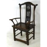 A Chinese hardwood armchair with a carve