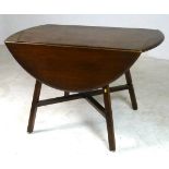 A dark stained Ercol drop leaf elm table