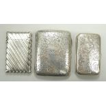 A silver cigarette case with engraved fo