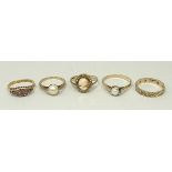 A group of rings, comprising a 15ct amet