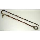 A malacca riding crop with white metal c