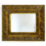 A rectangular carved giltwood mirror wit