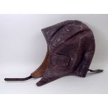 An early 20th century brown leather flyi