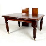 A Victorian mahogany extending dining ta