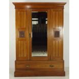 A Victorian Aesthetic walnut wardrobe, c