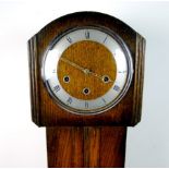 A 1930's grandmother clock, with a plaqu