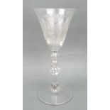A Newcastle light baluster wine glass, circa 1760, the ound funnel bowl engraved with the Arms of