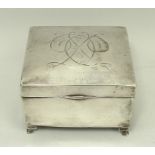 A silver box engraved with a monogram and the date 29/4/1913, indistinctly hallmarked, raised on