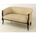A Victorian two seater settee upholstered in peach silk cotton fabric, with serpentine legs,