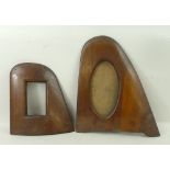 A pair of photograph frames formed from WWI wooden propeller wing tips, 20 by 19cm, and 27 by 24cm.