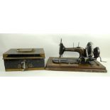 A Hobbs & co strong box, and a Regina sewing machine with a domed cover.