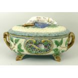 A Minton majolica twin handled game pie dish, cover and liner, the cover with hound finial, and