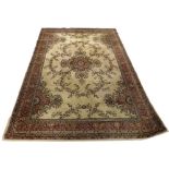 A mid 20th century Kemnor Wilton carpet with a cream ground, burgundy floral decoration with a