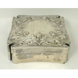 A Continental white metal box and cover, late 19th century, of Maltese cross form embossed to the