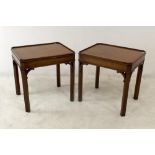 A pair of mahogany silver tables, with canted corners and raised gallery rim, circa 1970, by