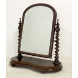 A 19th century mahogany toilet mirror with barleytwist uprights and shaped base, 72 by 29 by 78cm