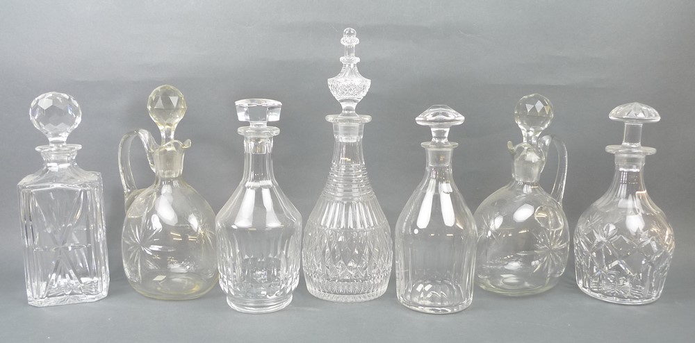 A group of cut glass decanters, 20th century, including one by Baccarat, France, and a near pair of