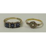 A sapphire and diamond ring, the three sapphires divided by four pairs of diamonds, platinum