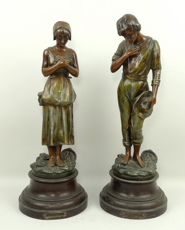 After De Ranieri, a pair of French spelter figurines, Angelus, cold painted, on a circular stepped