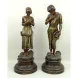 After De Ranieri, a pair of French spelter figurines, Angelus, cold painted, on a circular stepped